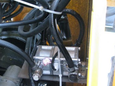 Feed and return fuel lines are connected to DFM differential fuel flow meter